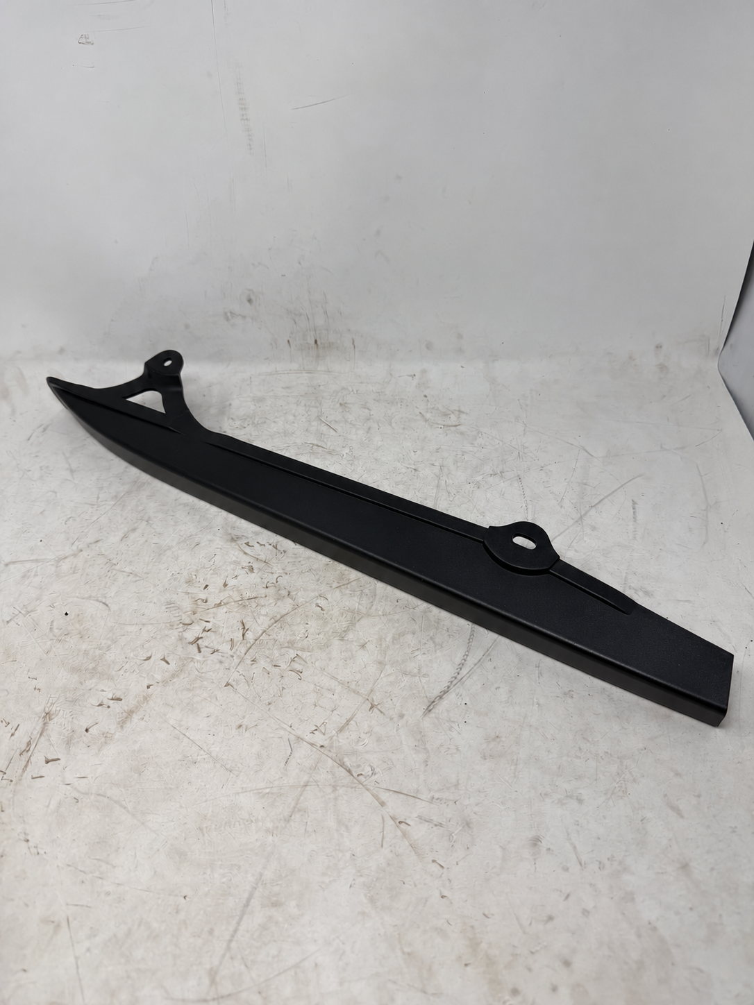 Black chain guard for DF250RTG Sportster 250cc motorcycle, outside view of long cover and two mounting holes