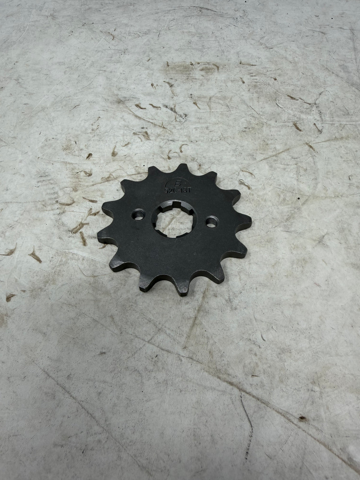 DF250RTG Venom Sportster 250cc front drive sprocket stamped 520-13T with 13 teeth, part 23401-MA95-0001