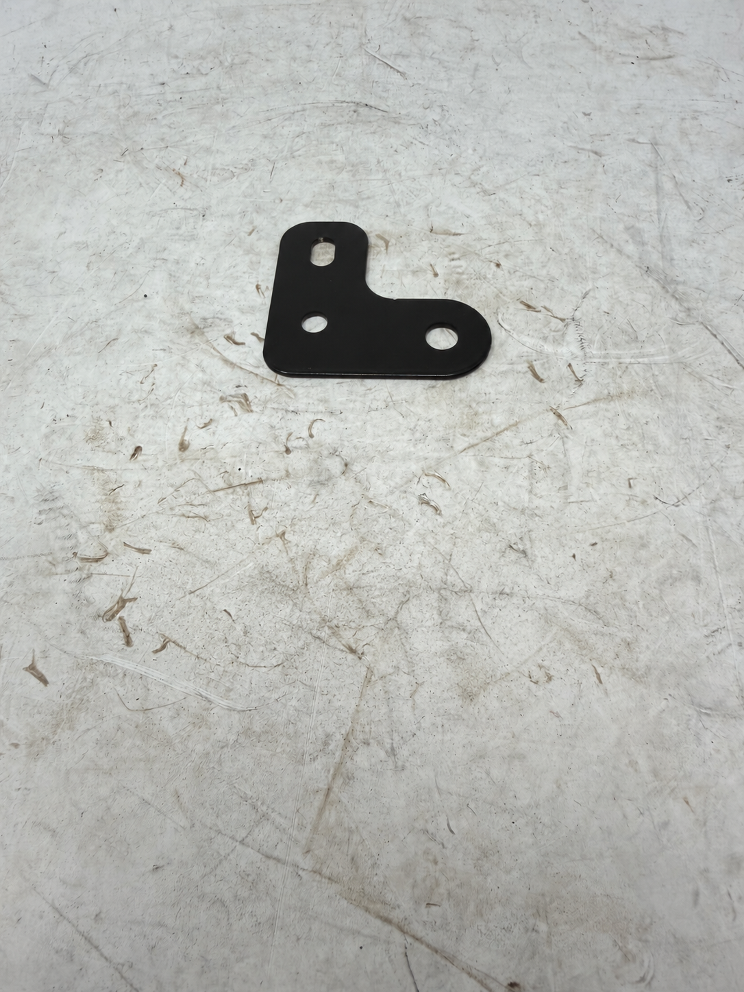 Black rear turn signal mounting bracket for DF250RTG Sportster 250cc motorcycle, reverse view of mounting plate