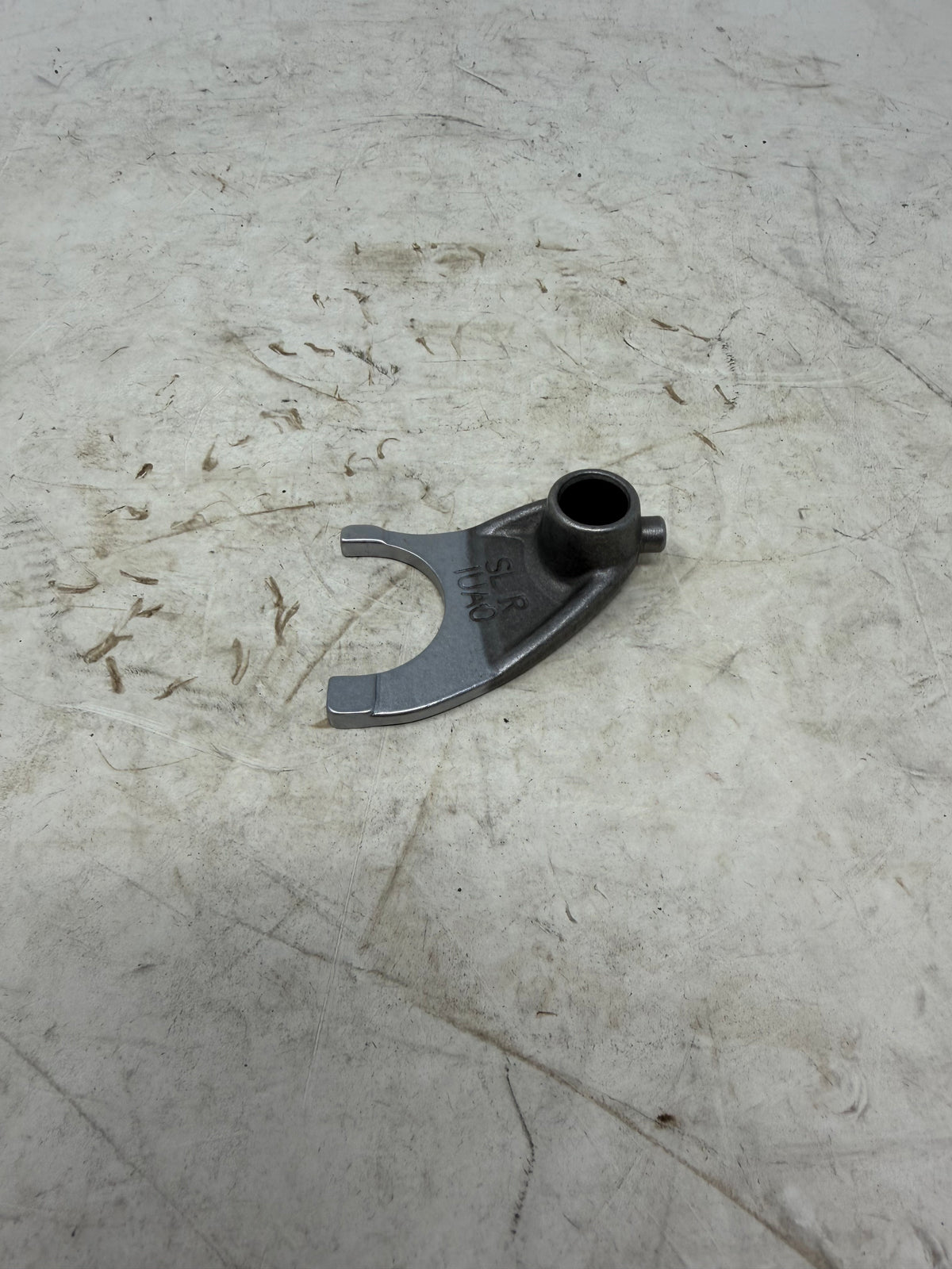 Alternate view of the DF250RTG Sportster 250cc right transmission shift fork showing its bore, fork arms and selector pin