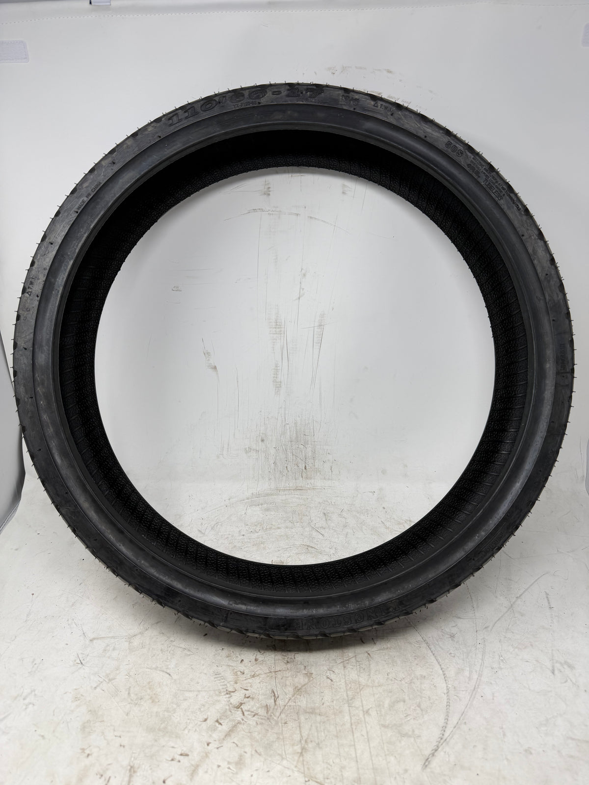 110/80-17 motorcycle tire, full sidewall view