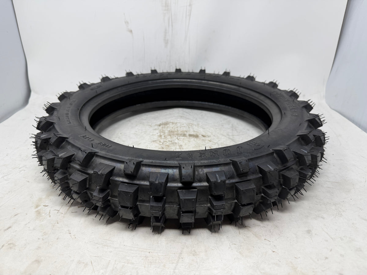 80/100-12 motorcycle tire, angled view showing tread pattern