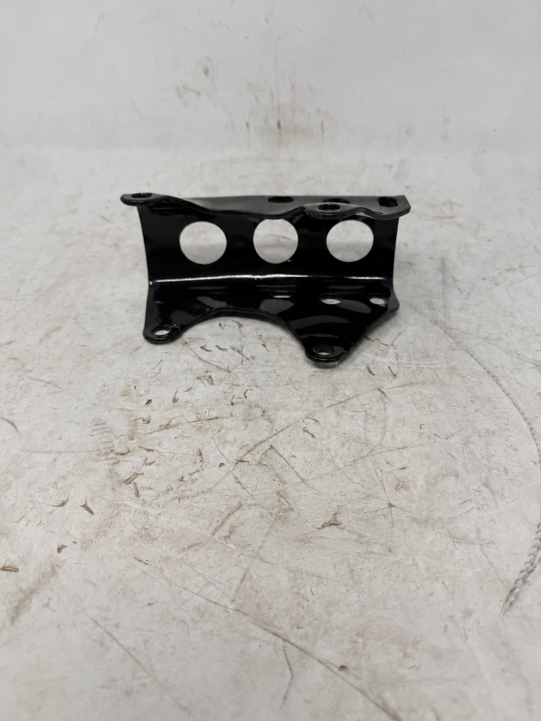 Black under-engine fixing plate with three circular openings for Sportster 250cc DF250RTG, front view
