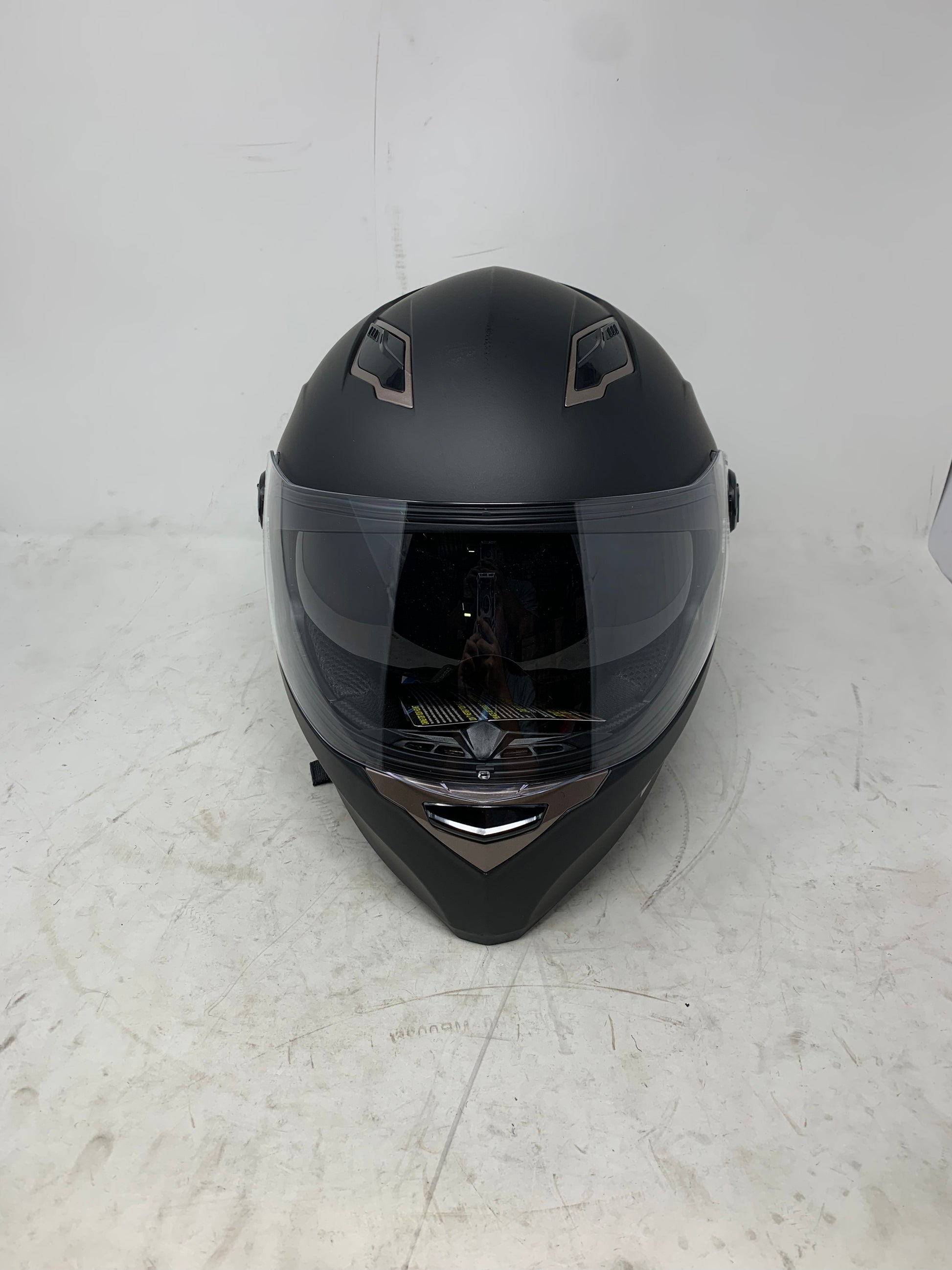 Motorcycle helmet with dual sun visor and clear outer shield