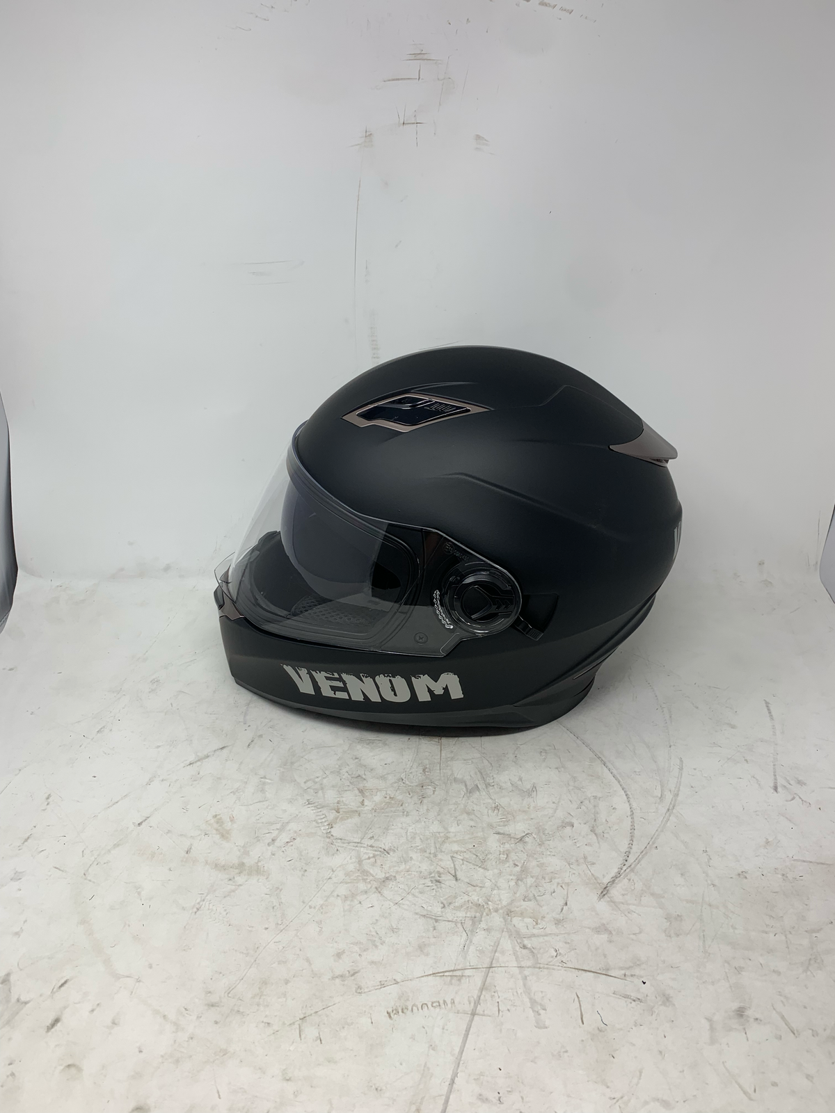 Matte black dual visor full face motorcycle helmet side profile and visor mechanism