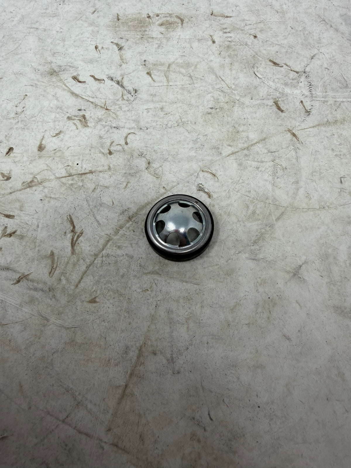 Reverse face of the DF250RTG Sportster 250cc round engine oil sight glass and surrounding black body
