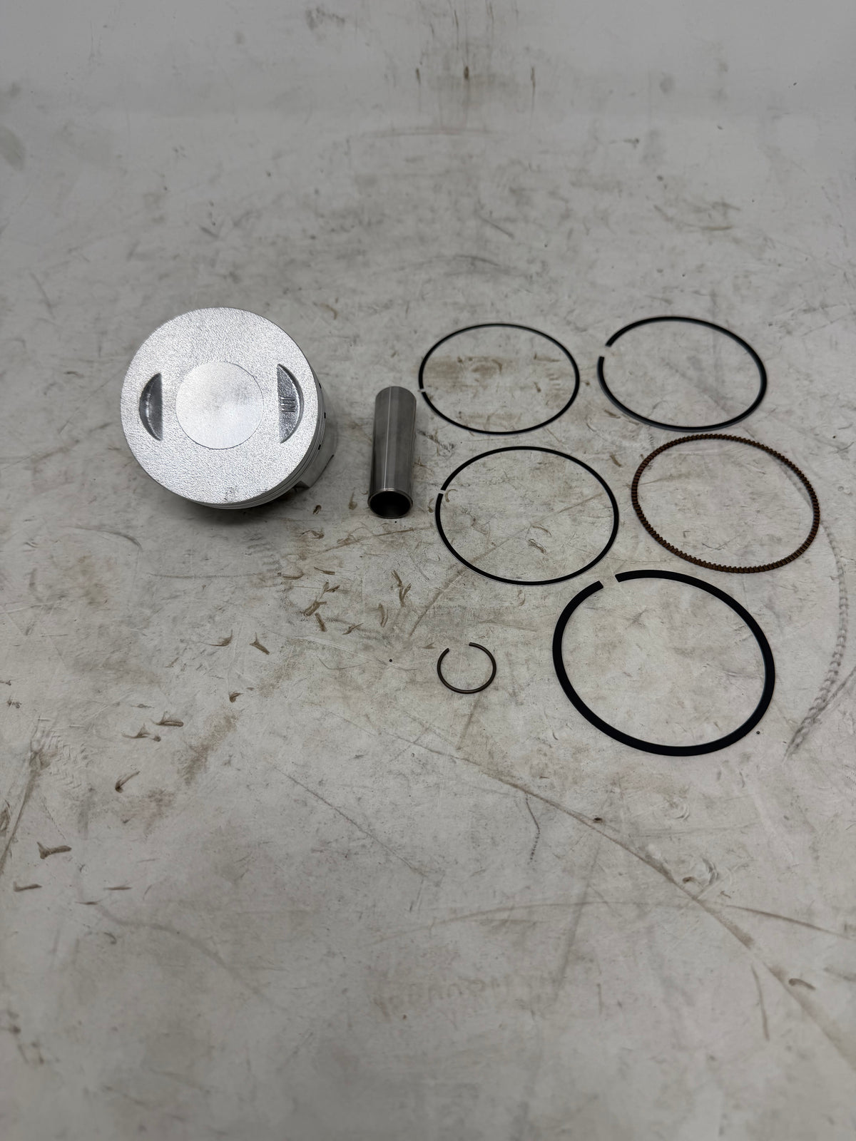 DF250RTG Venom Sportster 250cc piston kit with rings, pin and one retaining clip, piston 13101-LE26-0000, crown view