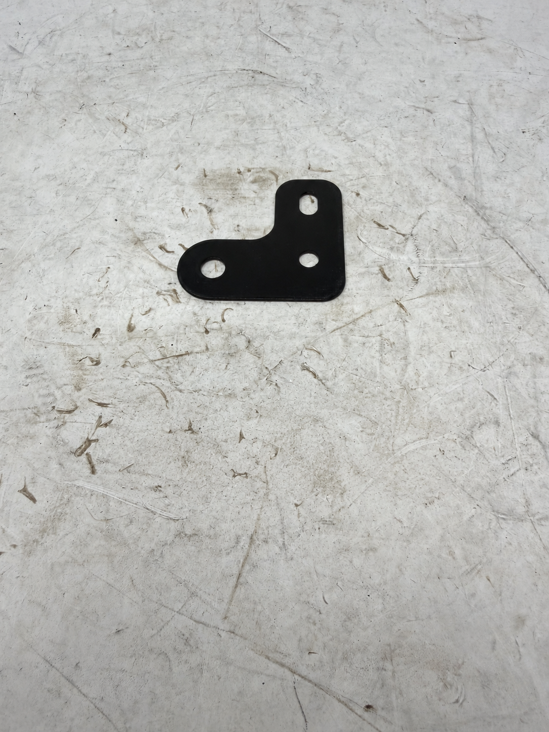 Black rear turn signal mounting bracket for DF250RTG Sportster 250cc motorcycle, front view with three mounting holes