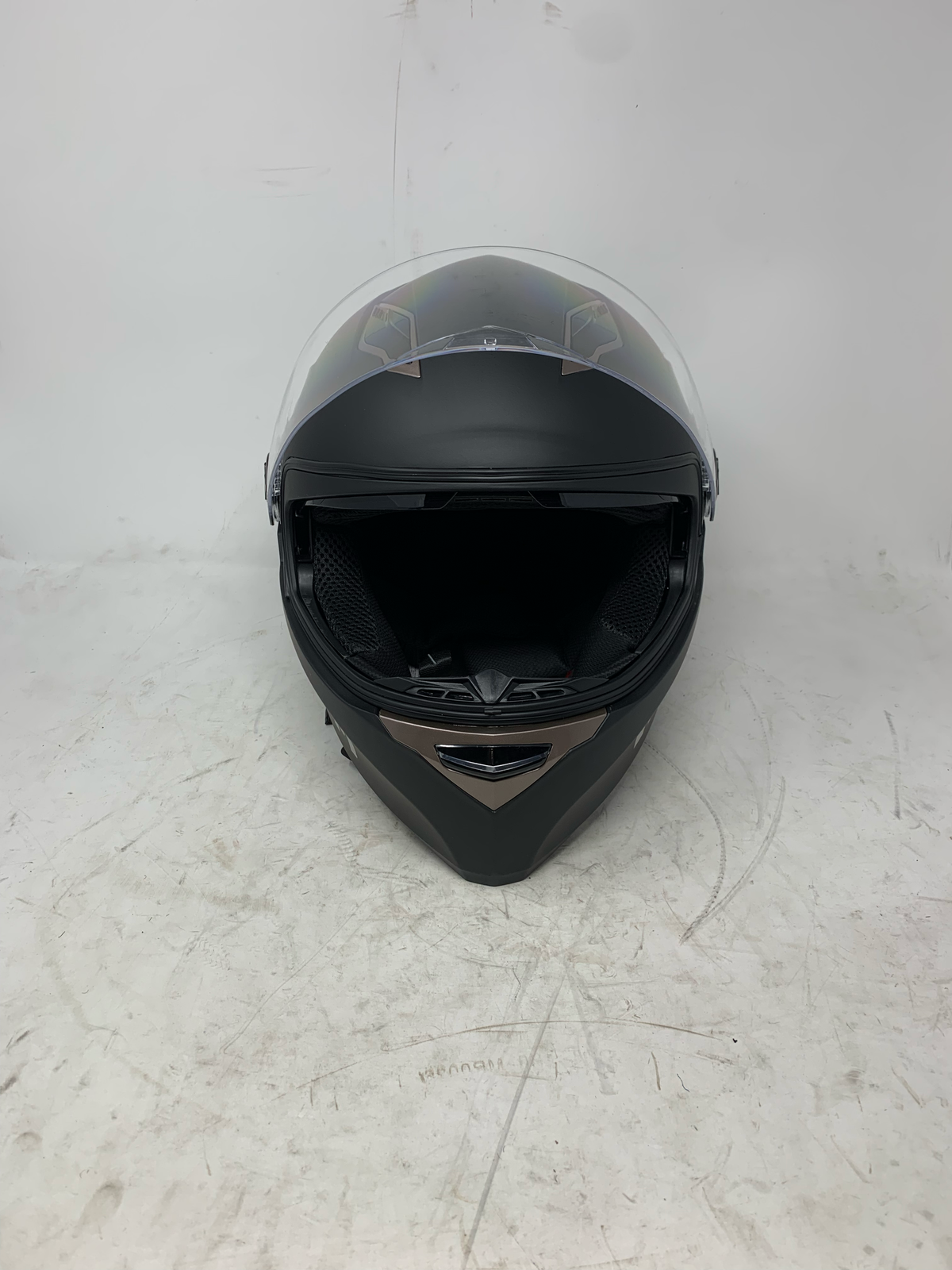 Full face black motorcycle helmet with clear face shield and inner sun visor raised