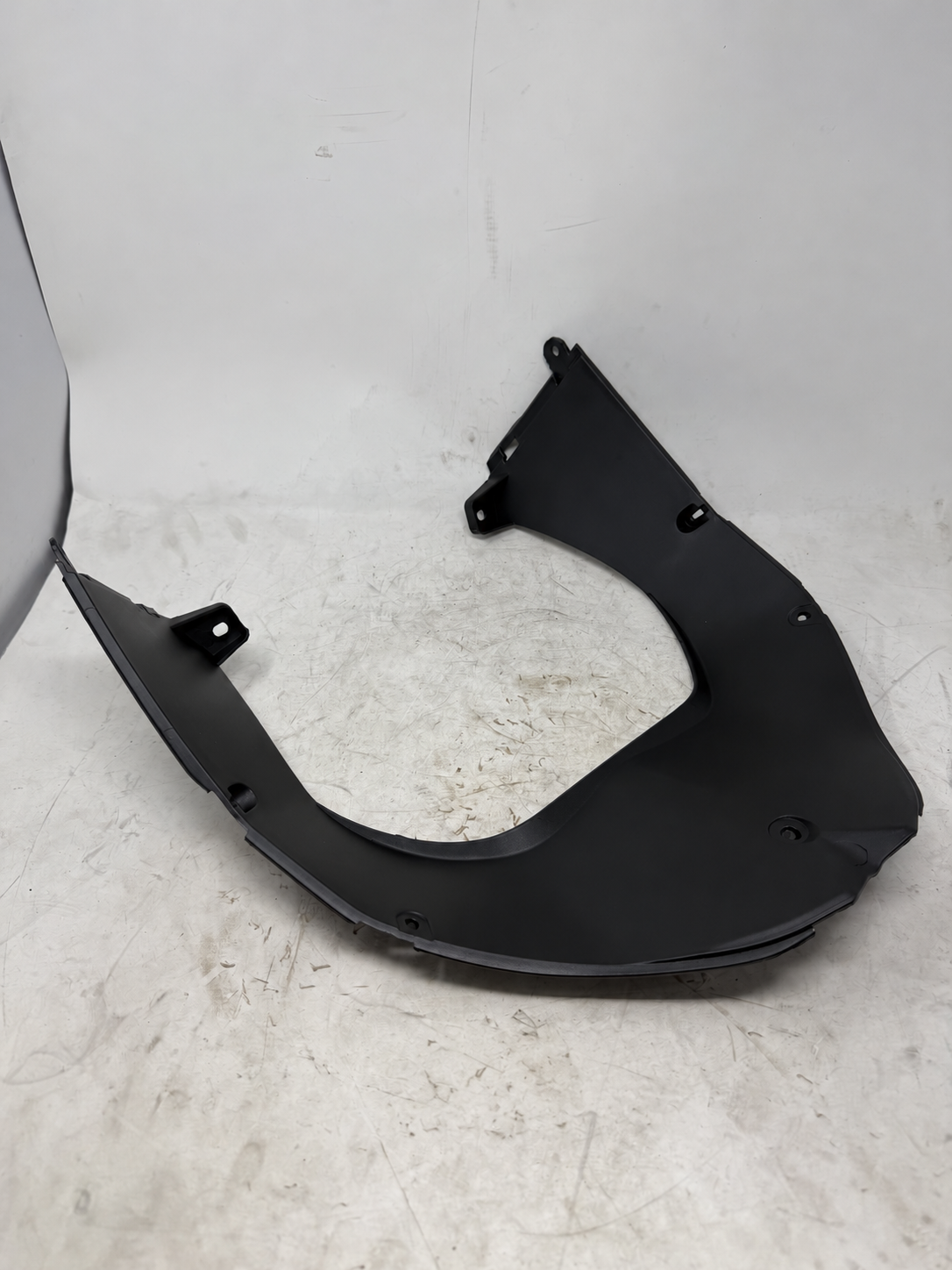Reverse view of black front floor trim panel for Venom X19 200cc DF200SST-23 automatic motorcycle